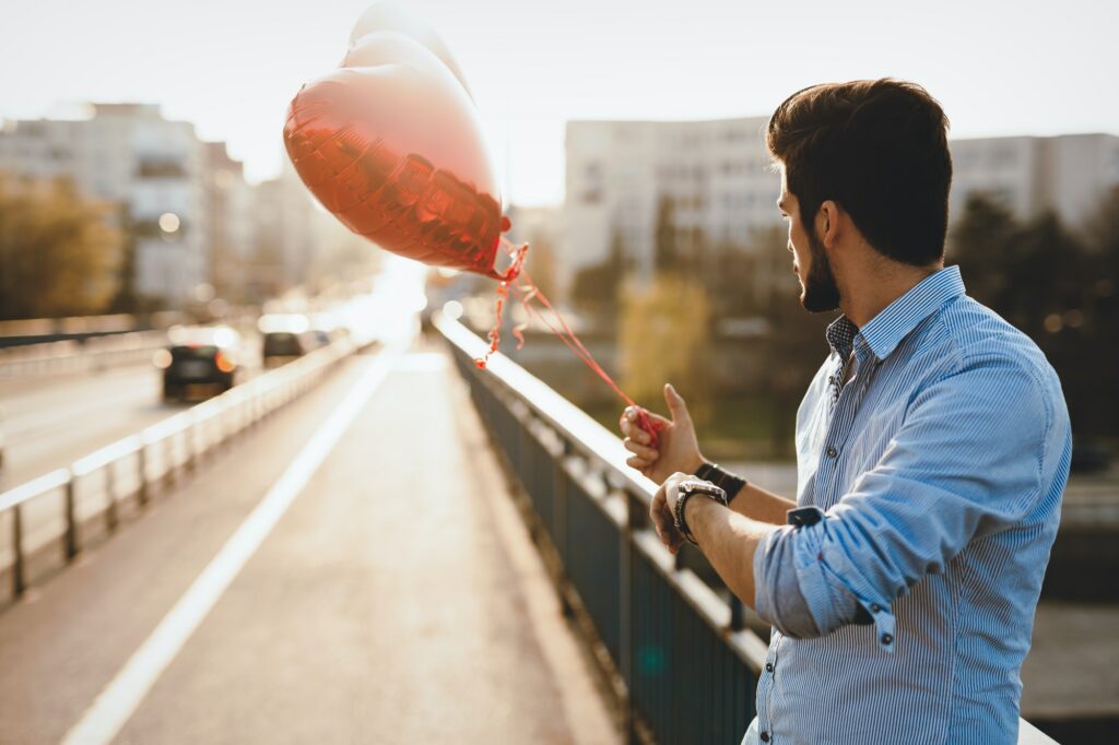 Sad man waiting for date on valentine date